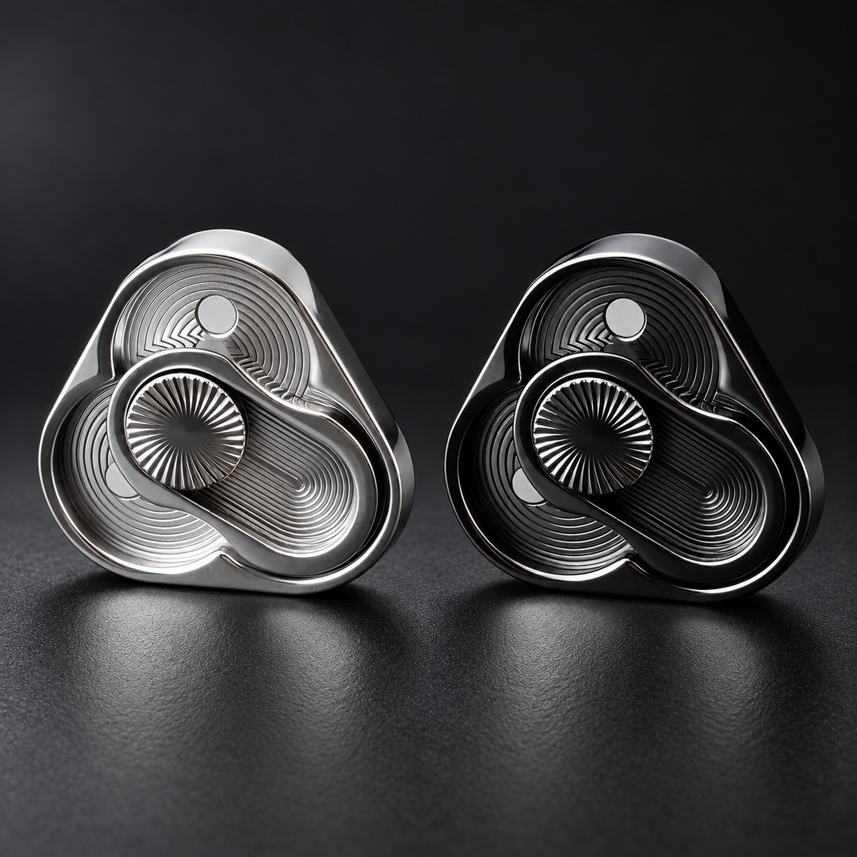 LHAPTIC TriArc Magnetic Slider in Silver and Black on a dark surface